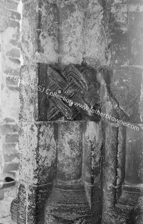 CASTLE RISING SAXON CARVINGS ON PILLAR OF WINDOW IN N. PASSAGE E. SIDE